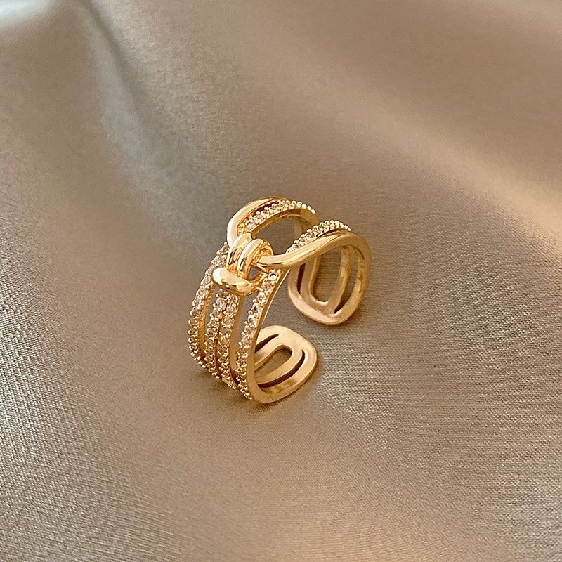 1.2ring<$3series07Golden Knot - Style Ring with Shimmering Detailing